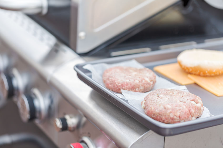 preparing burgers for gas grill