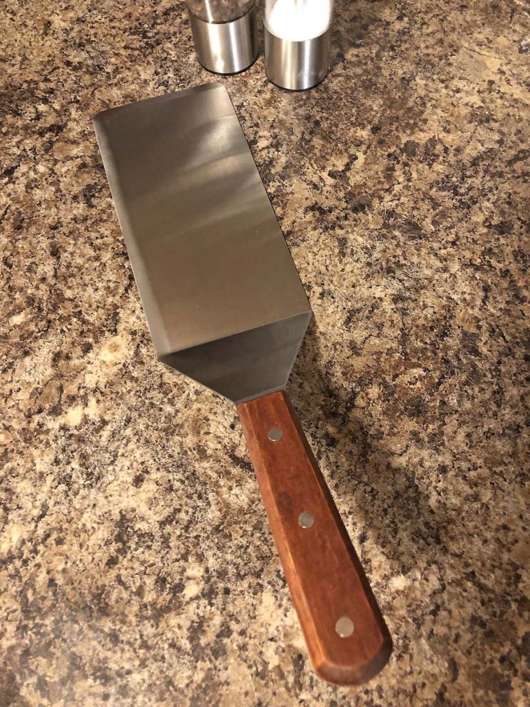 stainless steel spatula kitchen tool needed to make a burger